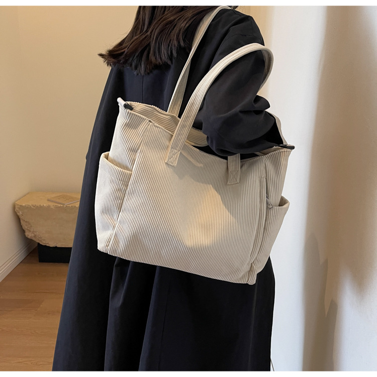 Large Capacity Art Student Shoulder Bag. Product information: Lining texture: Polyester, Applicable scenario: leisure travel, Color: creamy-white, green, black, Outer bag type: Sandwich pocket, Hardness: medium and soft, Material: corduroy, Suitcase shape