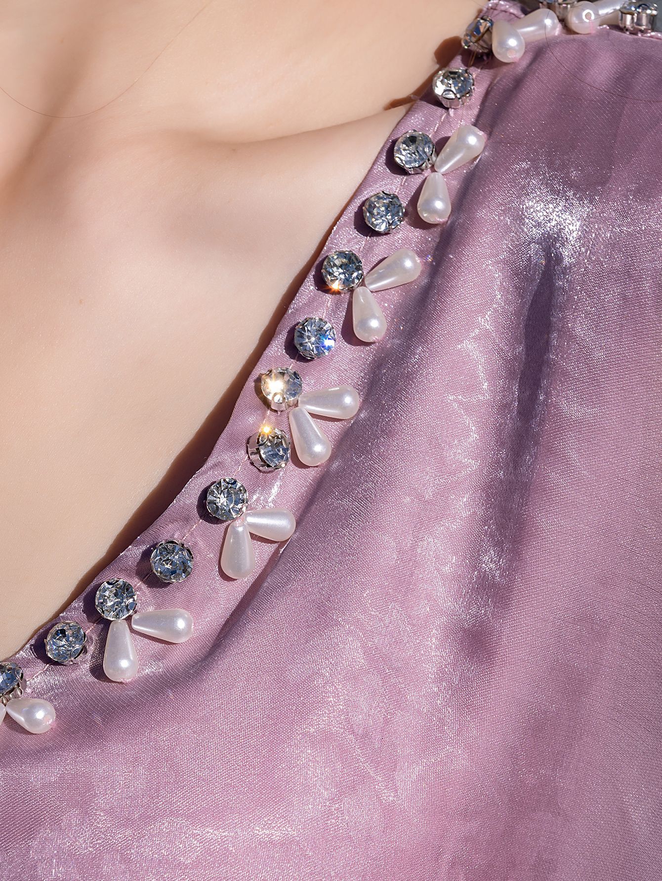 Traditional dress with cape sleeves - detail of streamer accents