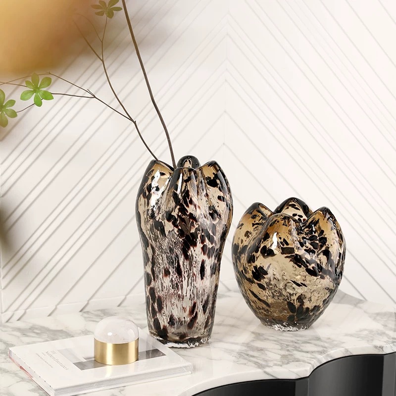A Variety Of Modern Glass Vases And Floral Arrangements For Showroom Displays And Home Decor