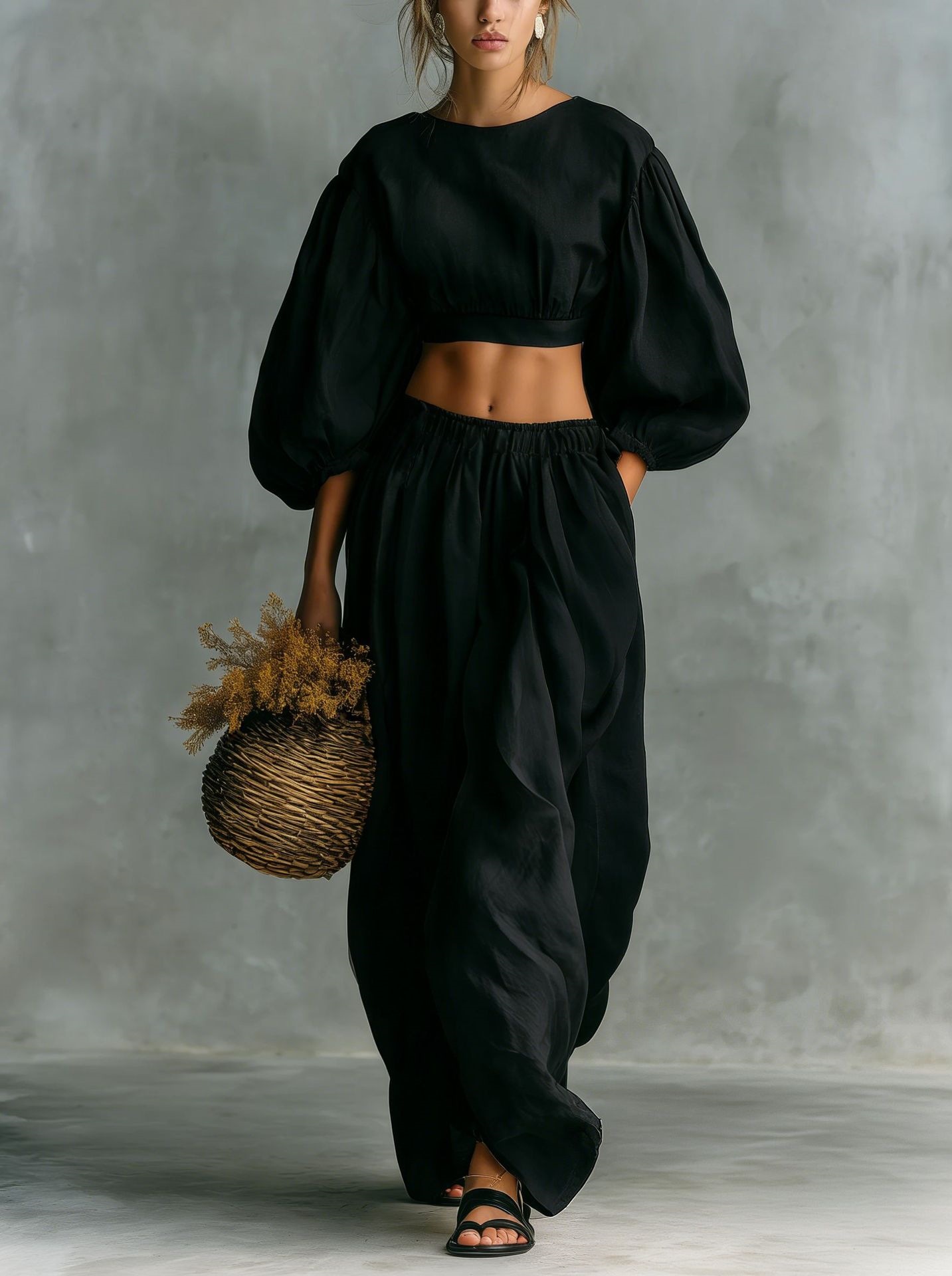 Women's matching set in black, full length view showing pants and top coordination