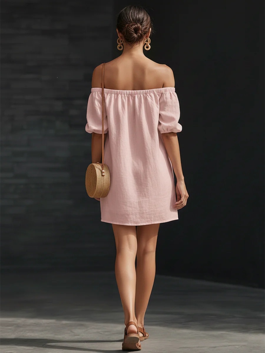 Women's puff-sleeve loose mini dress in black, side view showing off-shoulder neckline
