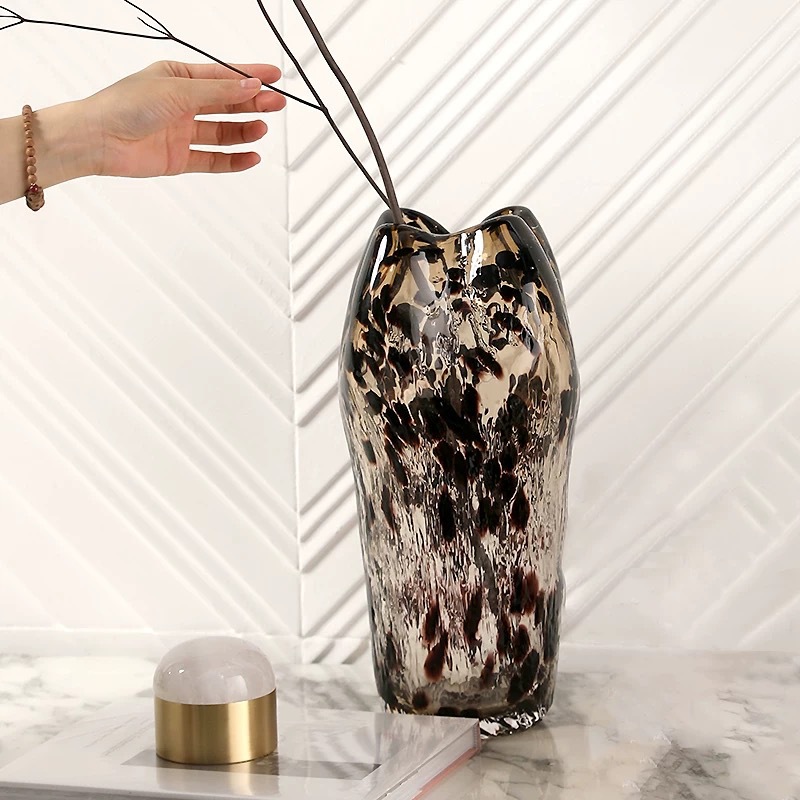 A Variety Of Modern Glass Vases And Floral Arrangements For Showroom Displays And Home Decor