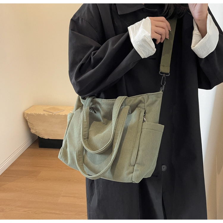 Large Capacity Art Student Shoulder Bag. Product information: Lining texture: Polyester, Applicable scenario: leisure travel, Color: creamy-white, green, black, Outer bag type: Sandwich pocket, Hardness: medium and soft, Material: corduroy, Suitcase shape