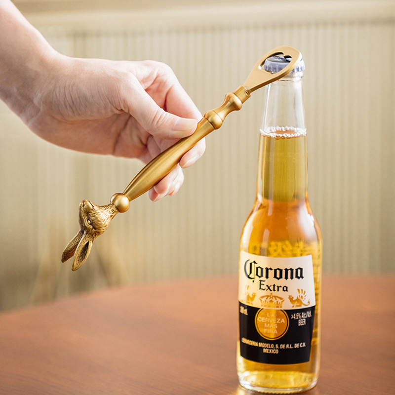 Retro brass bottle opener with rabbit and elk design