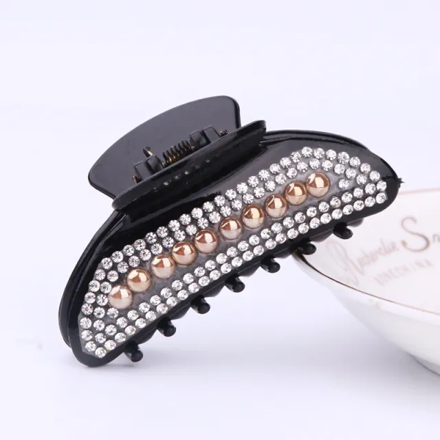 Simple Electroplated Pearl Rhinestone Moon Clip Ingot Claw Medium Plastic Grip Orange Pearl Black Background - Shop at LoveMi