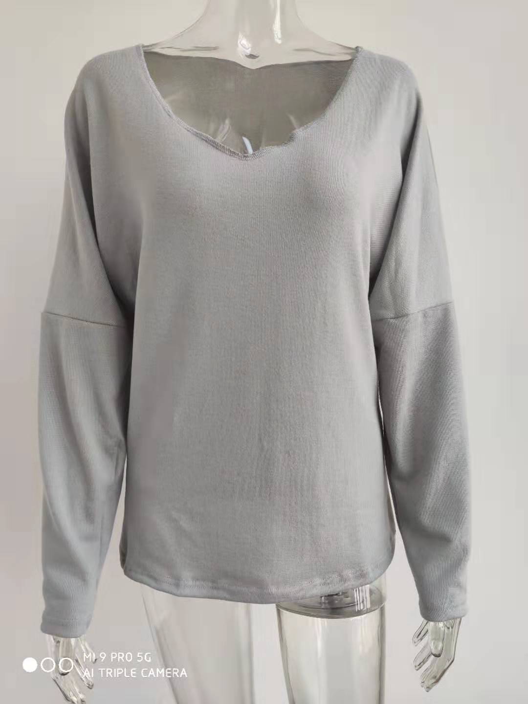 Title 15, Simple long sleeve V-neck pullover for women. A...