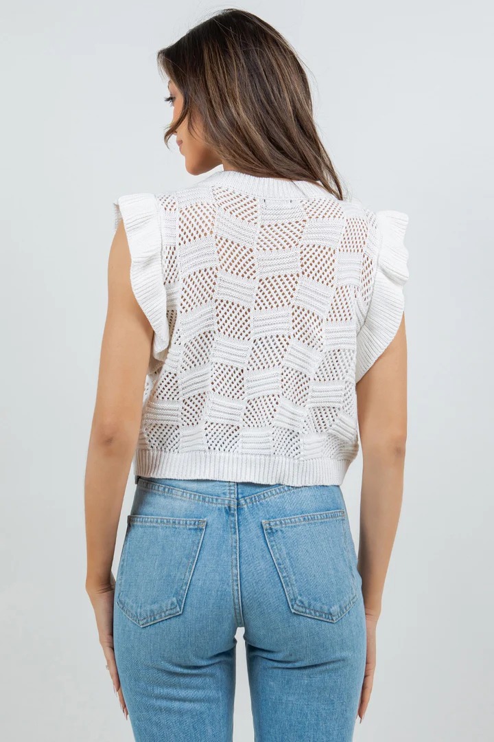 Close-up detail of women's hollow-out knit vest – open knit texture and fabric quality in Lake Blue