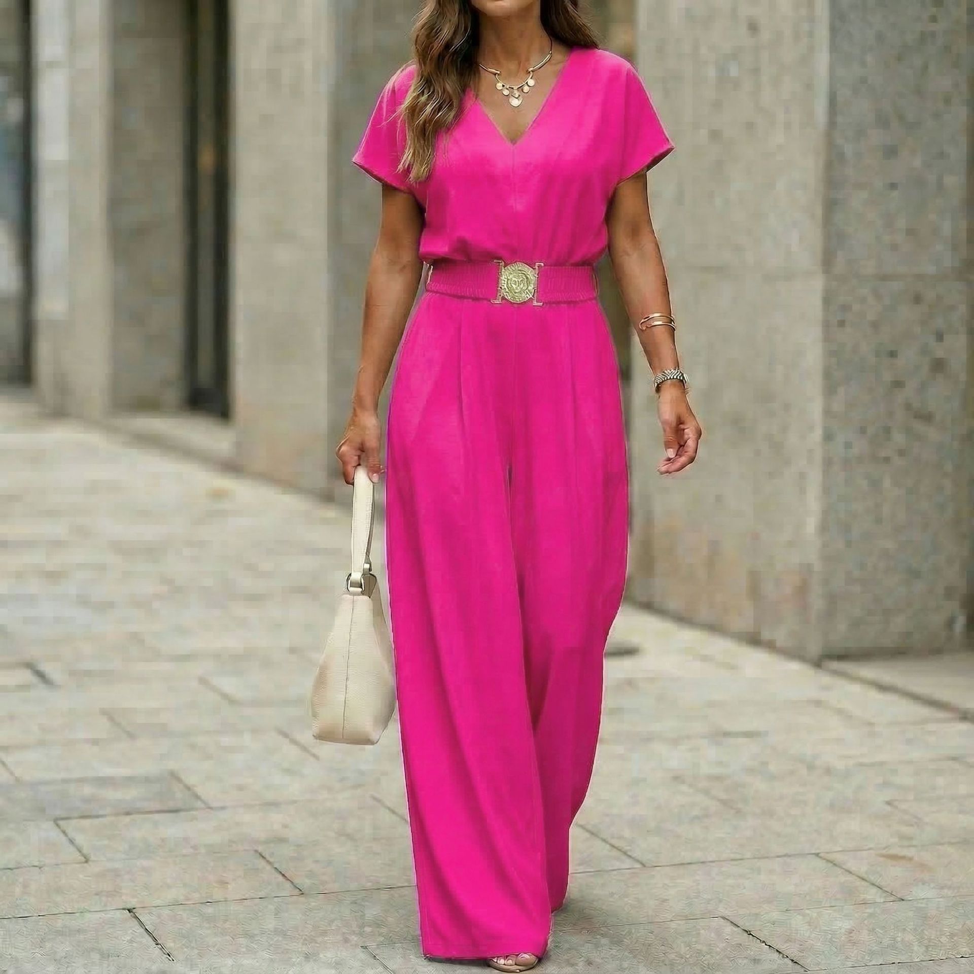 Women's wide-leg belted jumpsuit in rose red, back view showing full silhouette