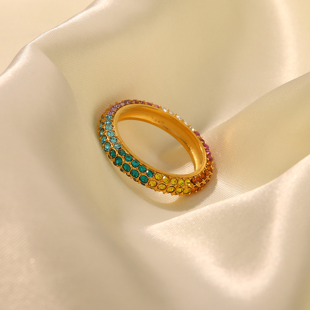 Title 5, Gold-plated stainless steel ring with inlaid co...