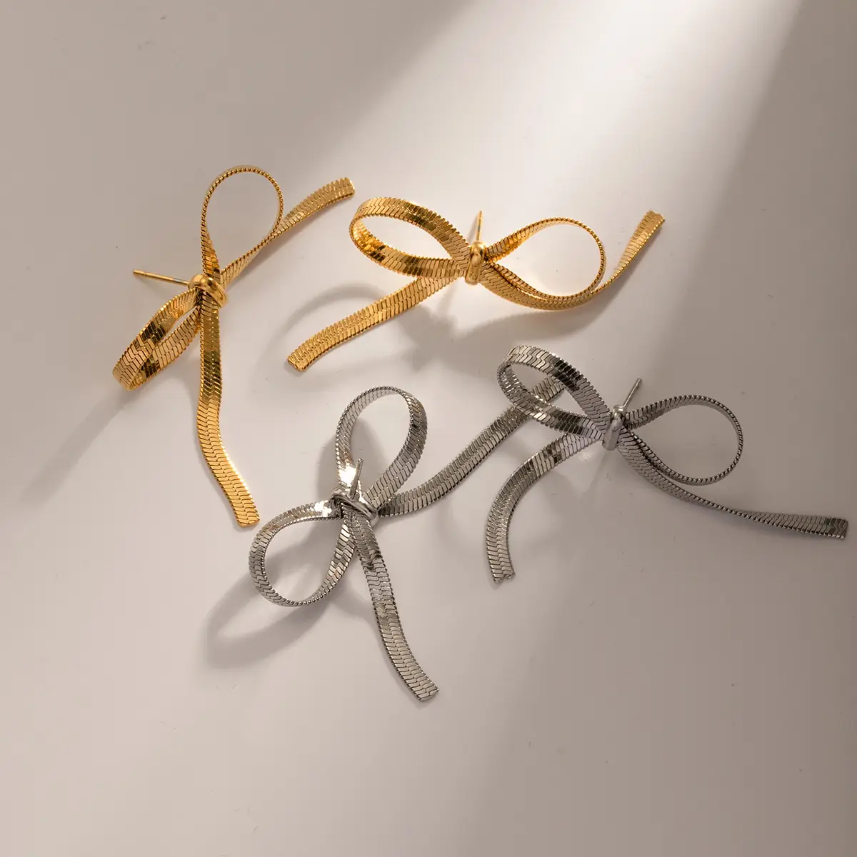 European And American Ins Style Graceful Personality 18K Gold Stainless Steel Chain Like Flat Snake Bow Earrings