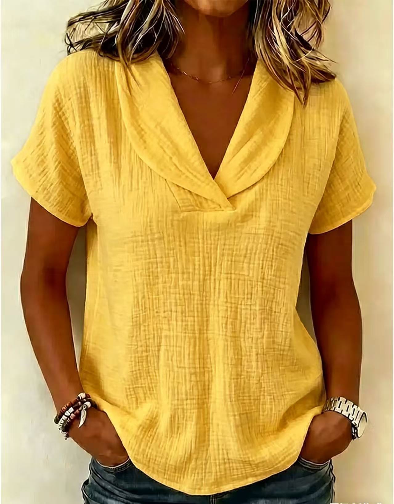 Women's knitted short-sleeve top in lotus pink, side view showing regular length
