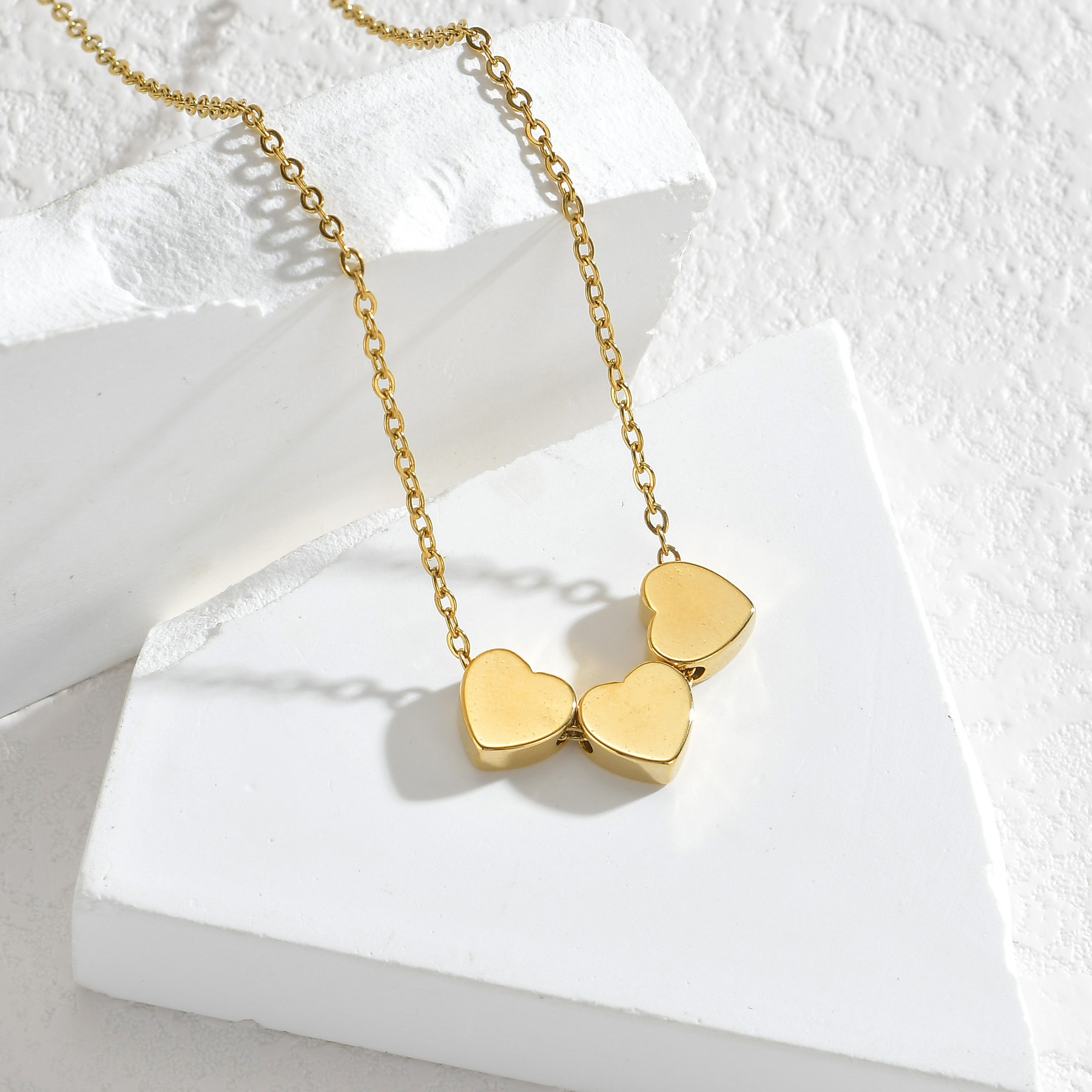 Minimalist Sleek Stainless Steel Pierced Heart Necklace With A Niche Designer Aesthetic For Women