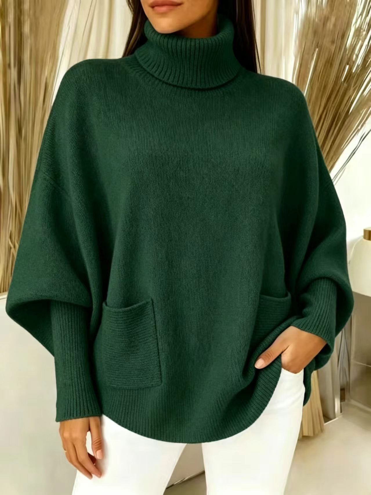 Turtleneck sweater – close-up of knit texture and curved hem detail