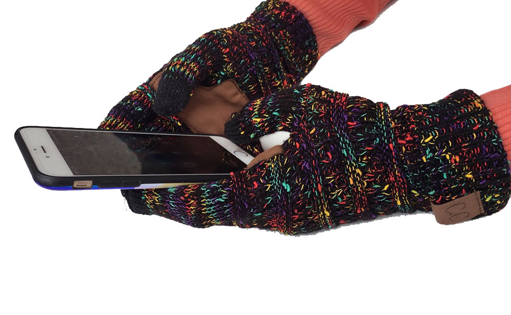 Someone wearing European and American Wool Knitted Turn-over Labeling Touch Screen Gloves gazes at their smartphone. These cozy gloves, made from warm acrylic fiber, showcase vibrant colors such as red, yellow, and blue against a black backdrop. With the phone cradled in both hands, the scene is both warmer for winter and undeniably fashionable.