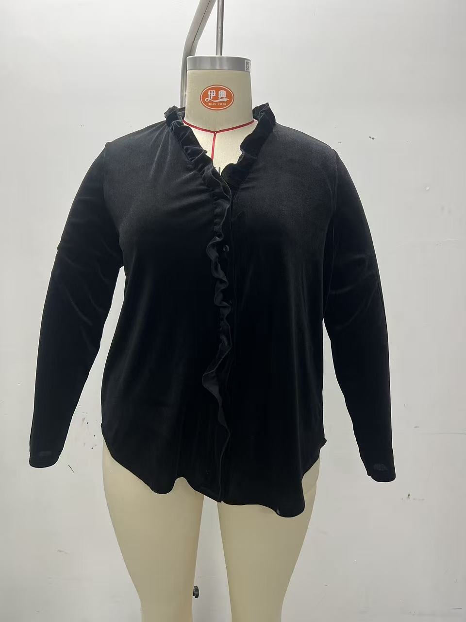 Women's velvet blouse back view — long sleeve curved hem