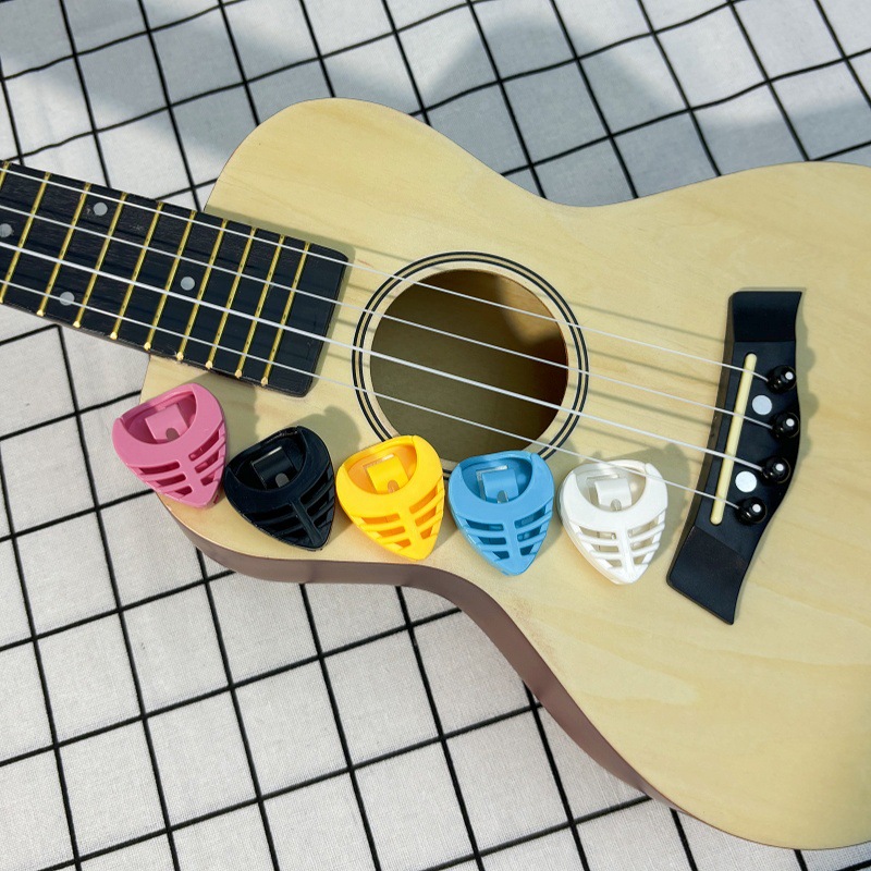 Title 4, Heart-shaped guitar pick box or bag. Safely sto...