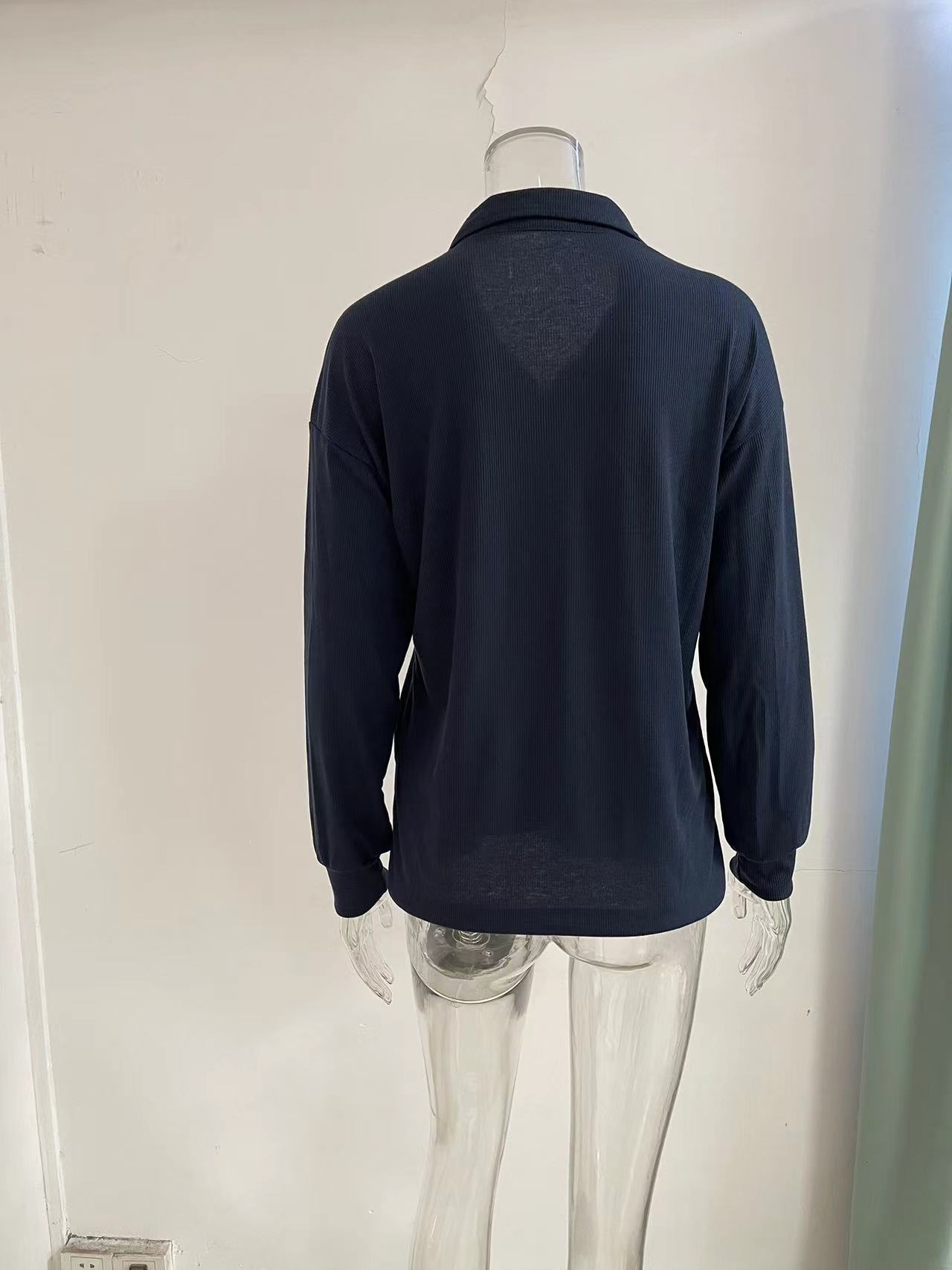 Women's knit top in white – model wearing size XL relaxed fit
