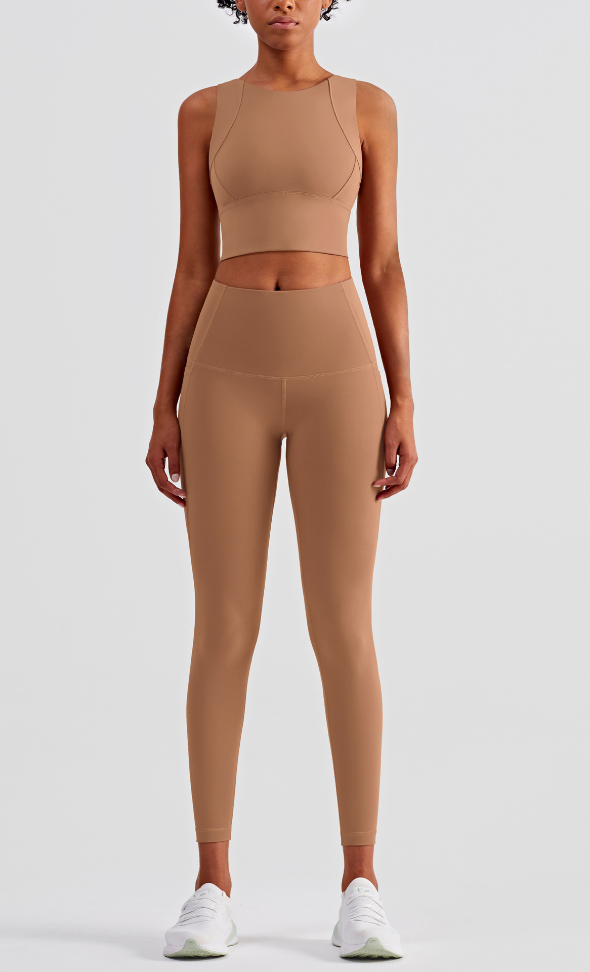 High-waist fitness pants showing stretchable fabric construction