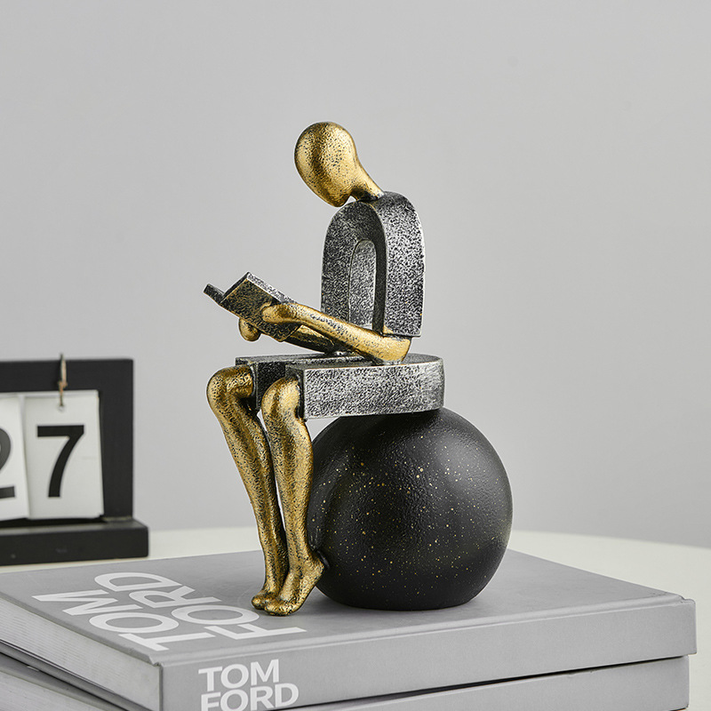 Abstract Resin Desk Ornament Of A Figure Reading And Pondering