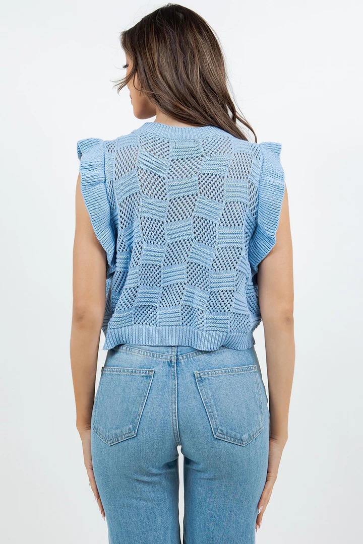 Women's sleeveless knit vest in Lake Blue styled for casual boho outfit with wide-leg pants