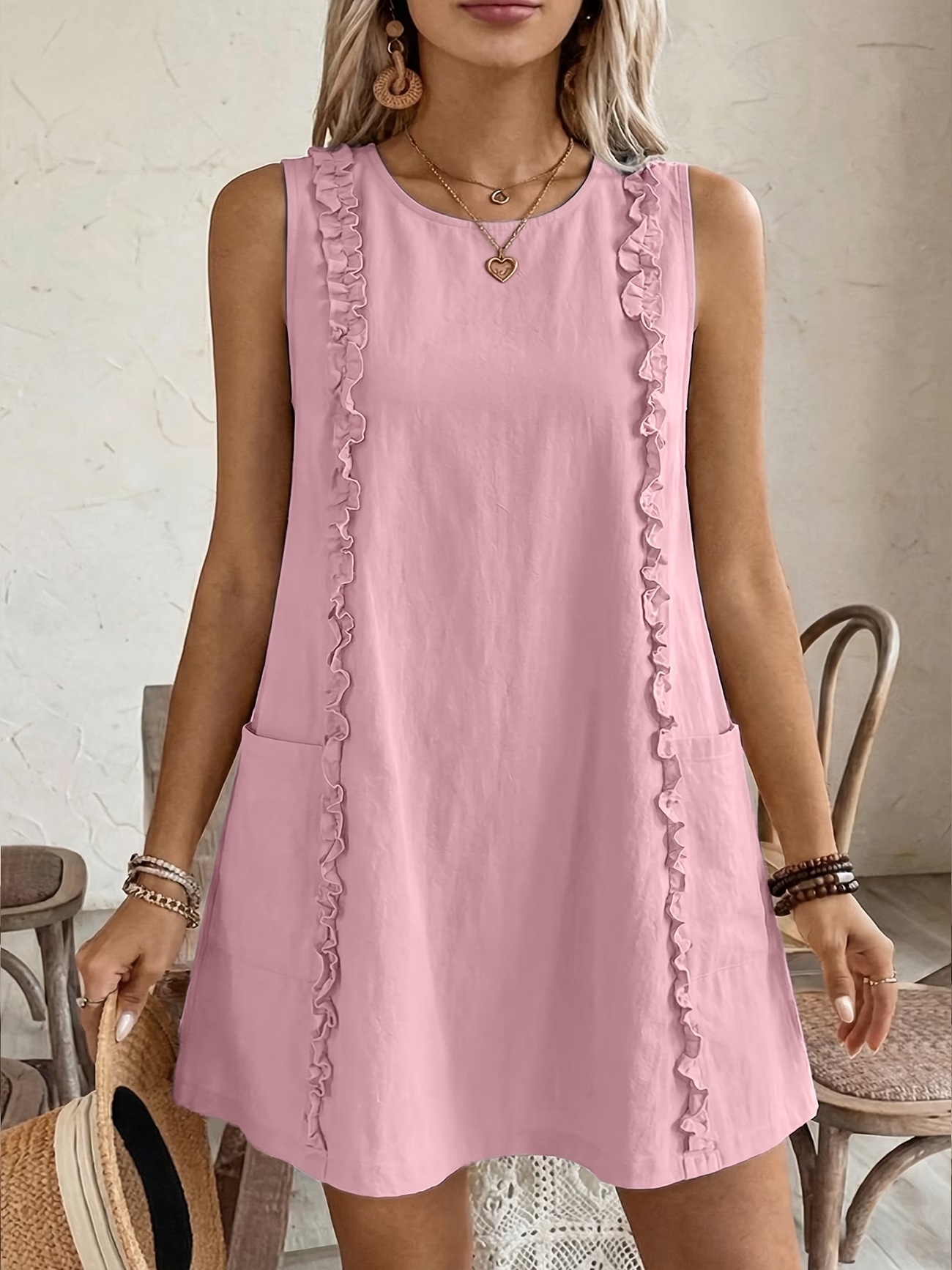 Women's ruffle dress in pink – lifestyle resort look