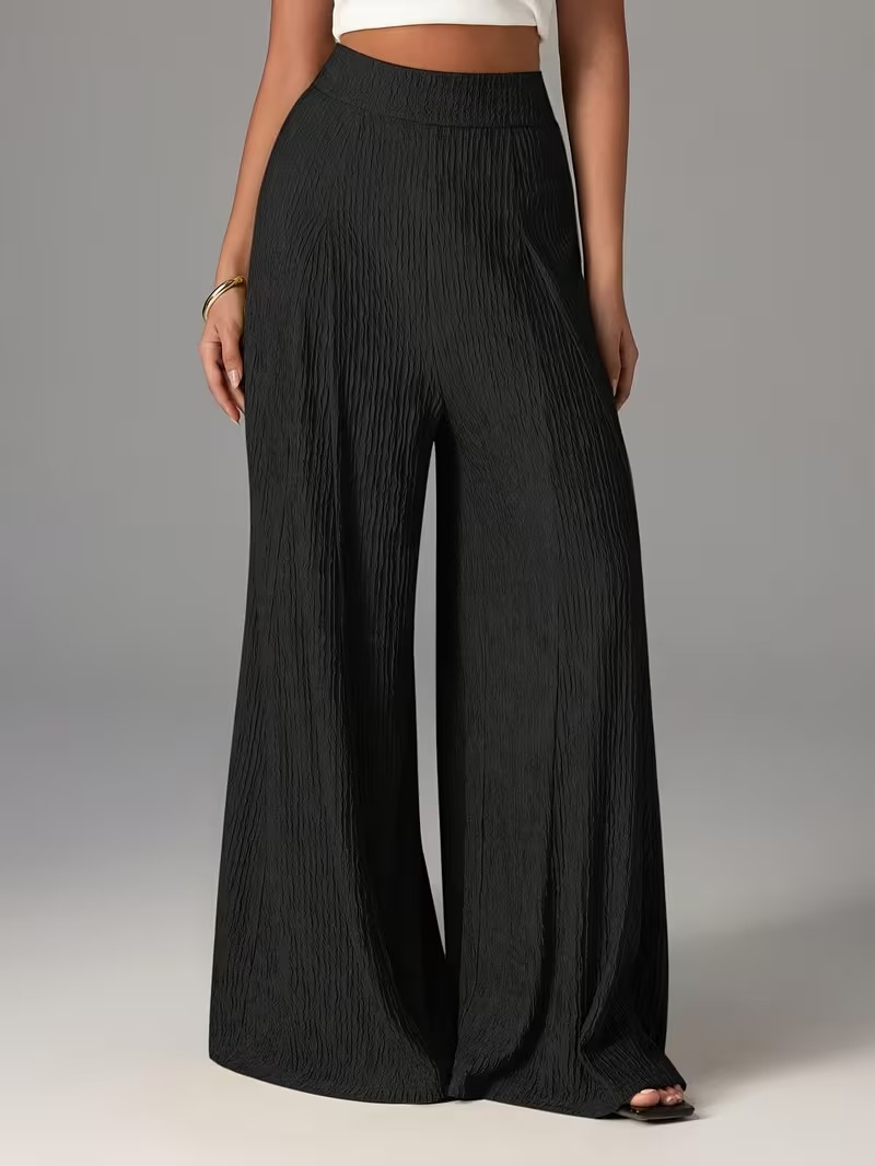 Pantalones holgados de color liso con cintura elástica y talle alto. 821233b6 2104 44ba B9bb 9cd73df1c02b