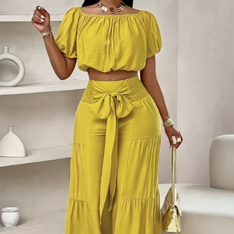 High-waisted Solid-color Flared Pants With Tie Detailing And A Flowing Drape - Image 1