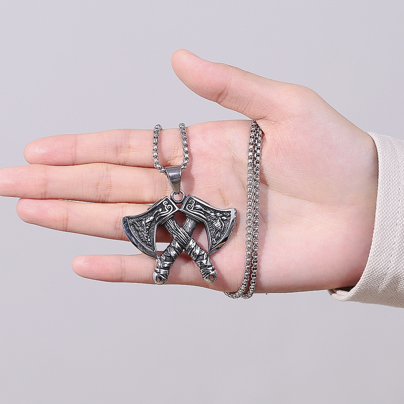 Men's Crossed-Axe Pendant Necklace - hand-held view of pendant detailing and chain
