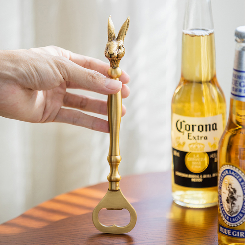 Retro brass bottle opener with rabbit and elk design