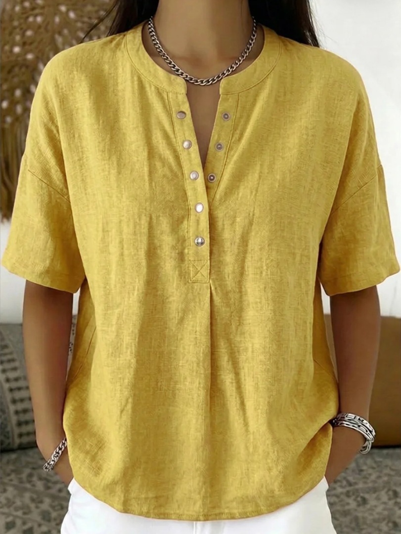 Women's solid color loose-fit short-sleeve pullover top, front view showing relaxed silhouette