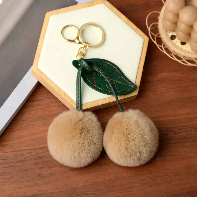 Real Otter Rabbit Fur Grass Little Cherry Car Keychain Pendant - Milk Tea Colour