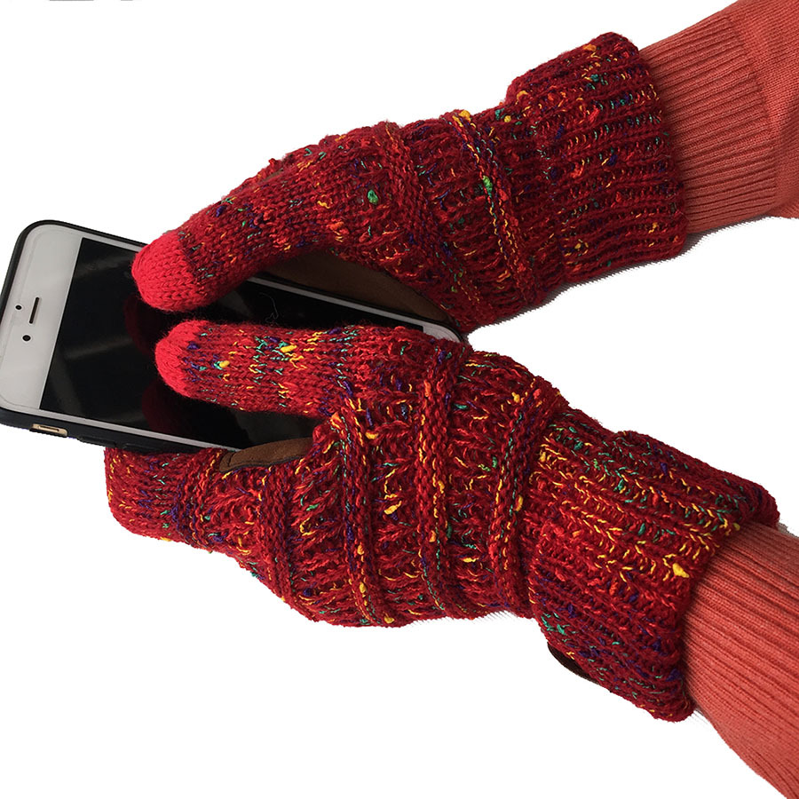 A pair of hands wearing European and American Wool Knitted Turn-over Labeling Touch Screen Gloves is holding a smartphone. These gloves are crafted from warm wool, featuring a textured pattern with hints of yellow and green, and are designed for touch screen compatibility—ideal for winter days.