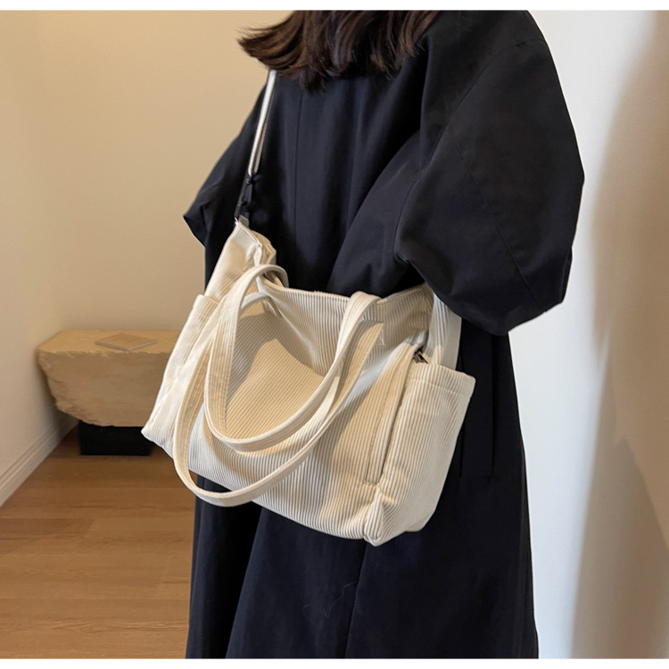 Large Capacity Art Student Shoulder Bag. Product information: Lining texture: Polyester, Applicable scenario: leisure travel, Color: creamy-white, green, black, Outer bag type: Sandwich pocket, Hardness: medium and soft, Material: corduroy, Suitcase shape