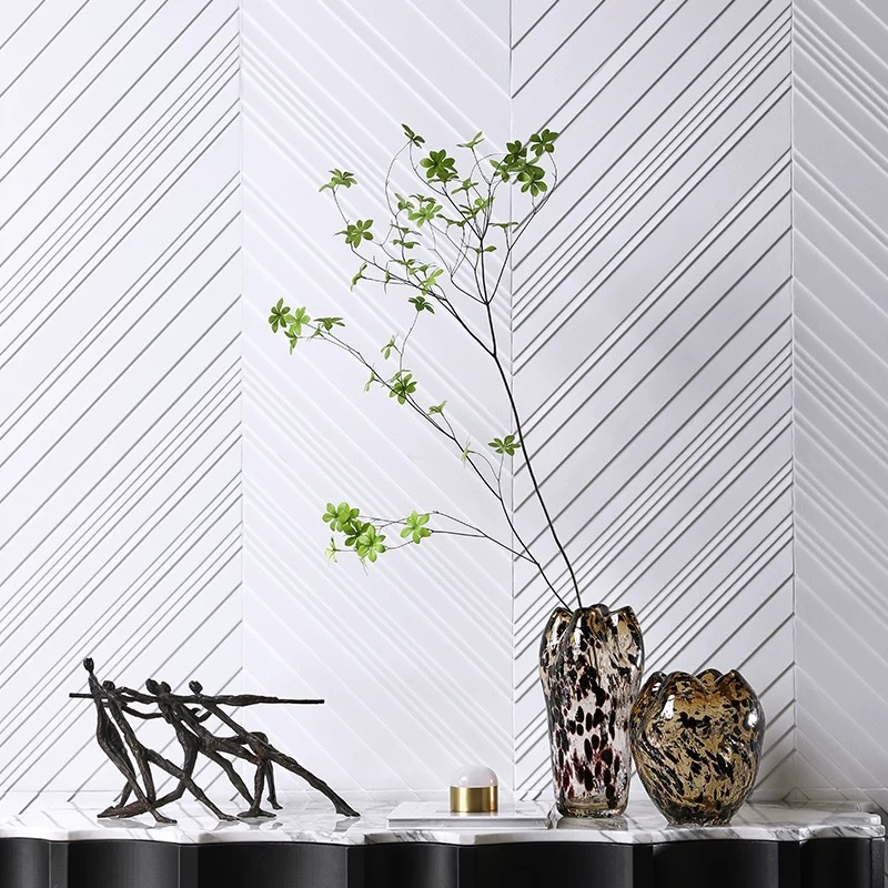 A Variety Of Modern Glass Vases And Floral Arrangements For Showroom Displays And Home Decor