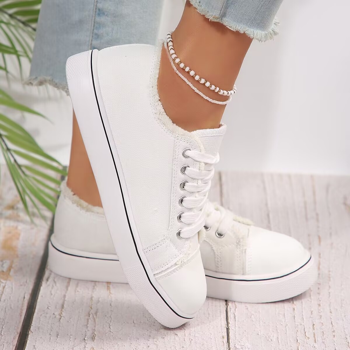 Lace-up canvas sneakers side view — Sarah Express