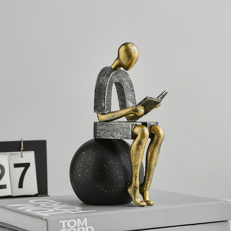 Abstract Resin Desk Ornament Of A Figure Reading And Pondering