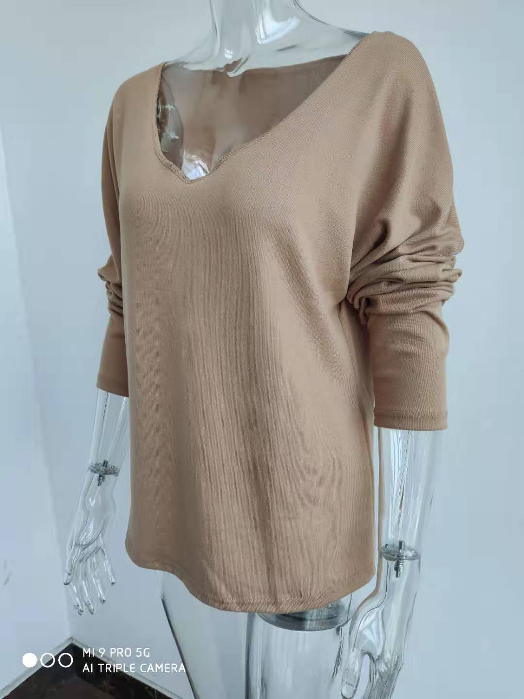 Title 10, Simple long sleeve V-neck pullover for women. A...