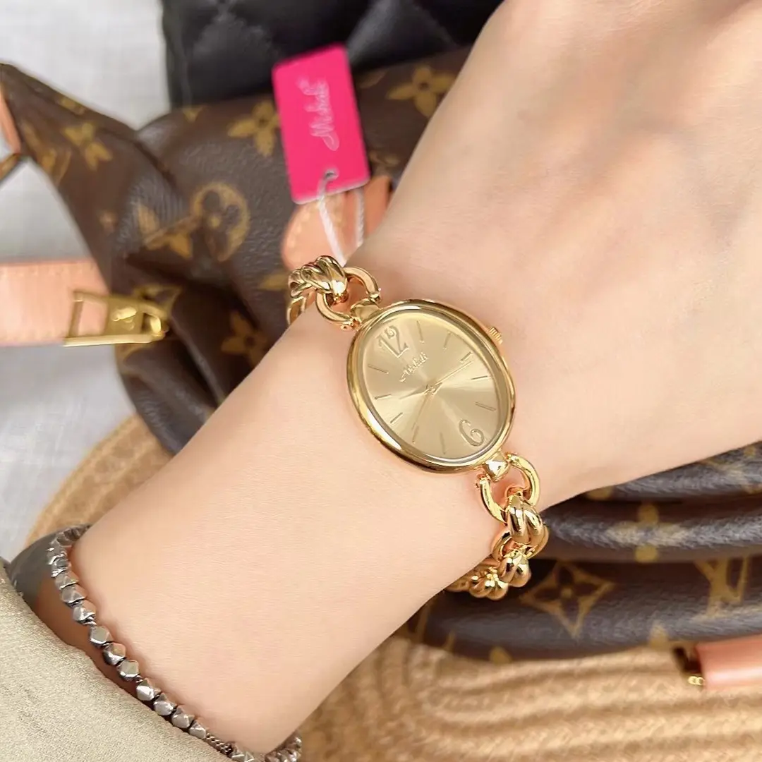 Lady's Steel Strap Watch Gold Oval Hollow