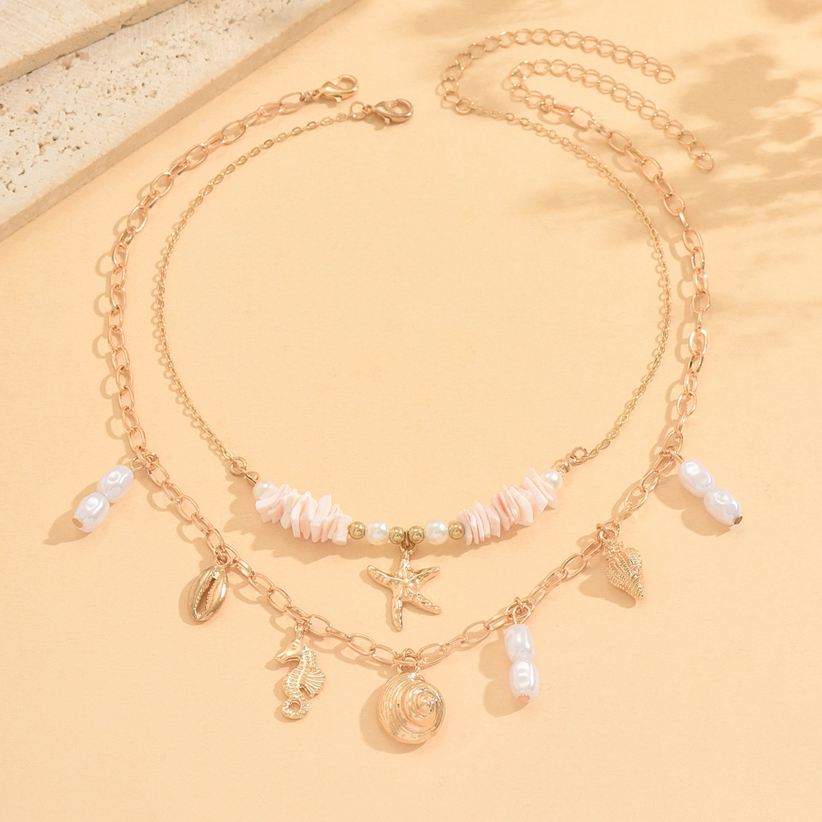 Detail view of starfish, conch, and seahorse charms