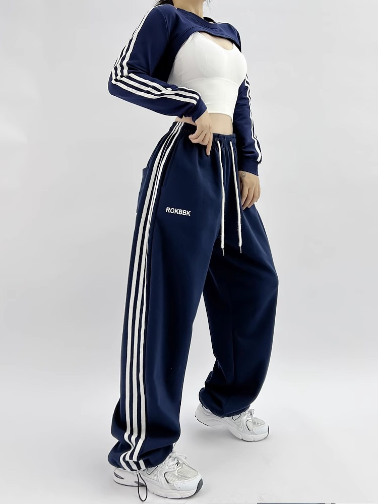 Embroidered patchwork sweatpants, model wearing outdoor casual lifestyle photo