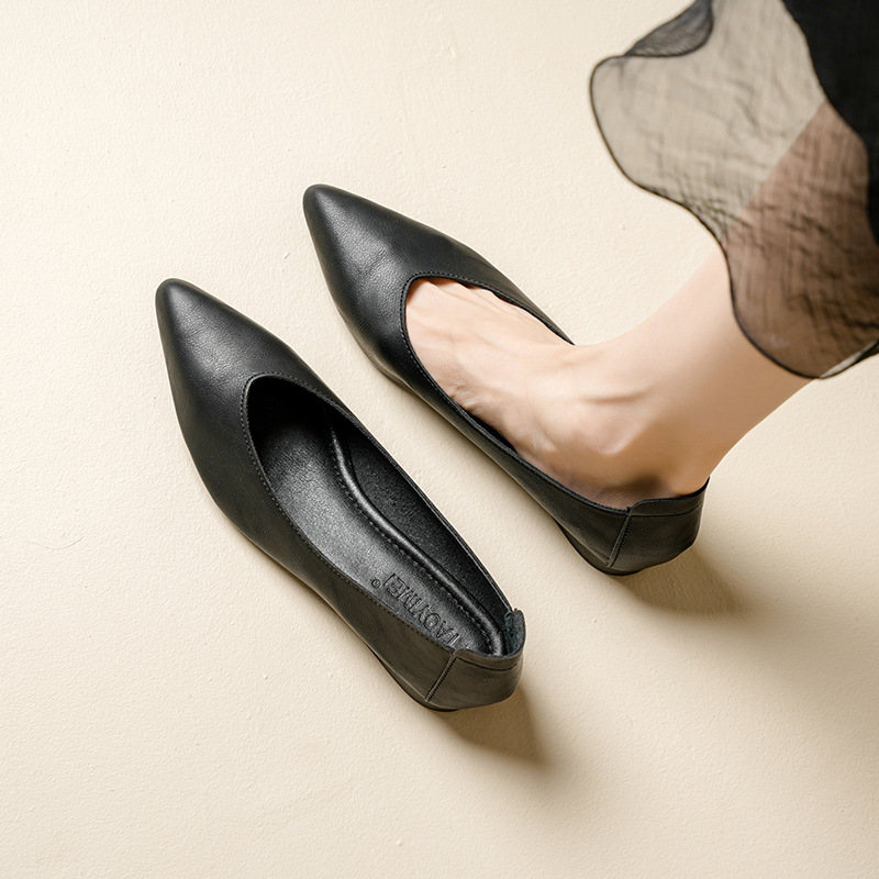 A Woman With Thick Heels Pointed Toes And Single Shoes