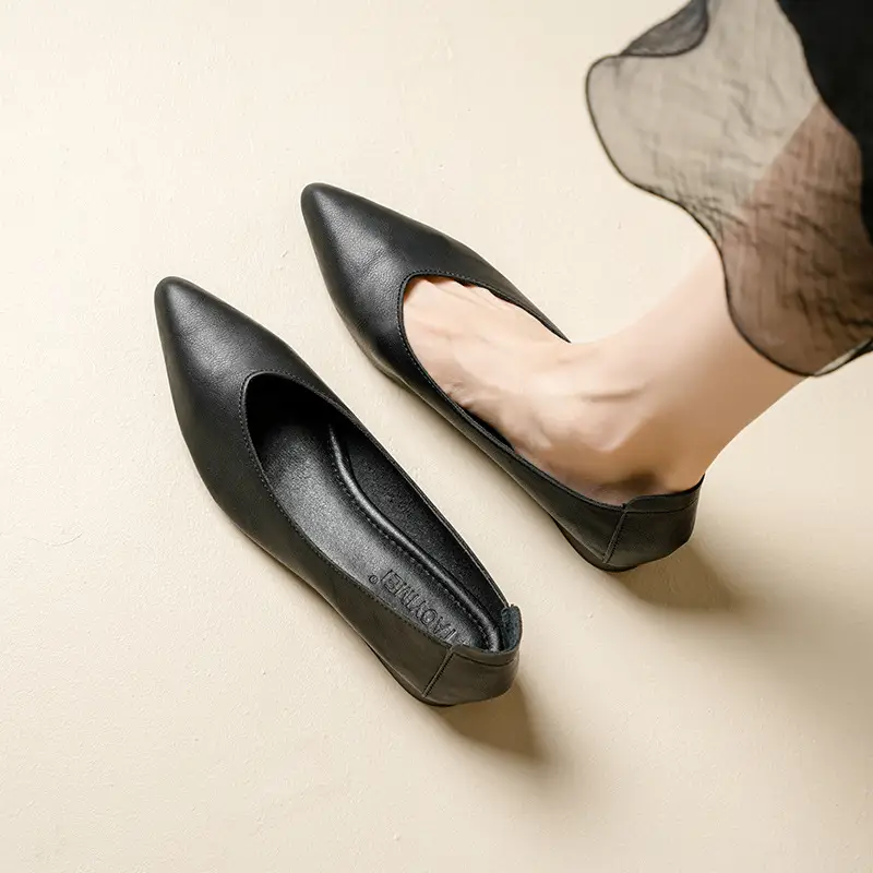 A Woman With Thick Heels Pointed Toes And Single Shoes