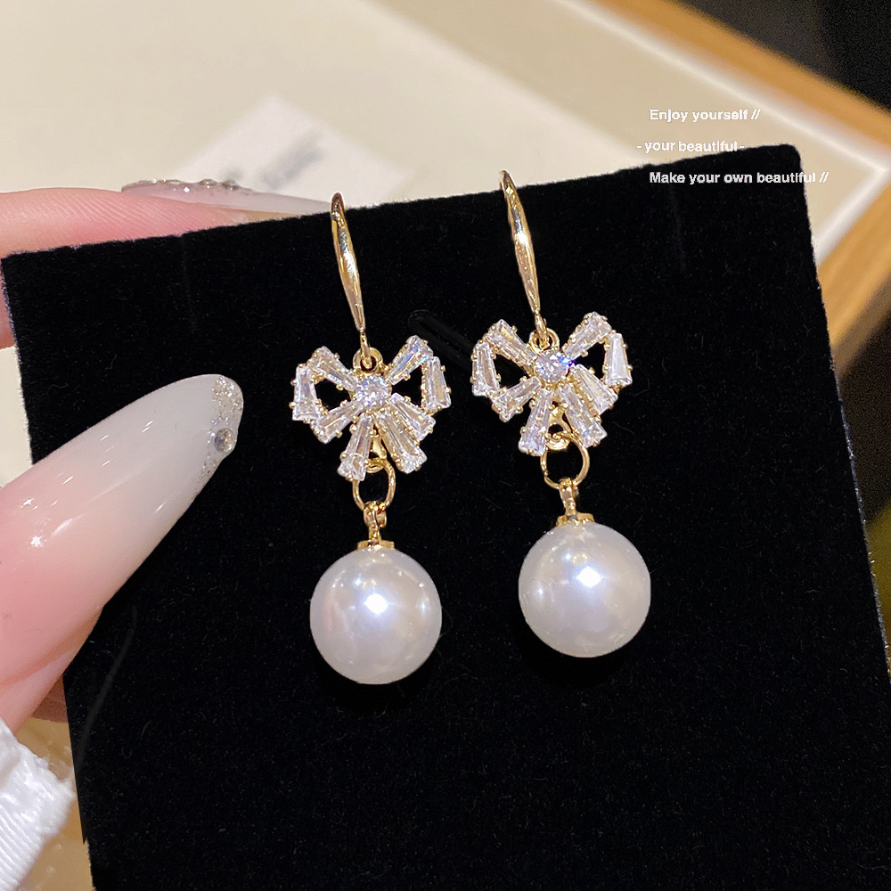 Pearl Earrings With A Bow Subtly Luxurious
