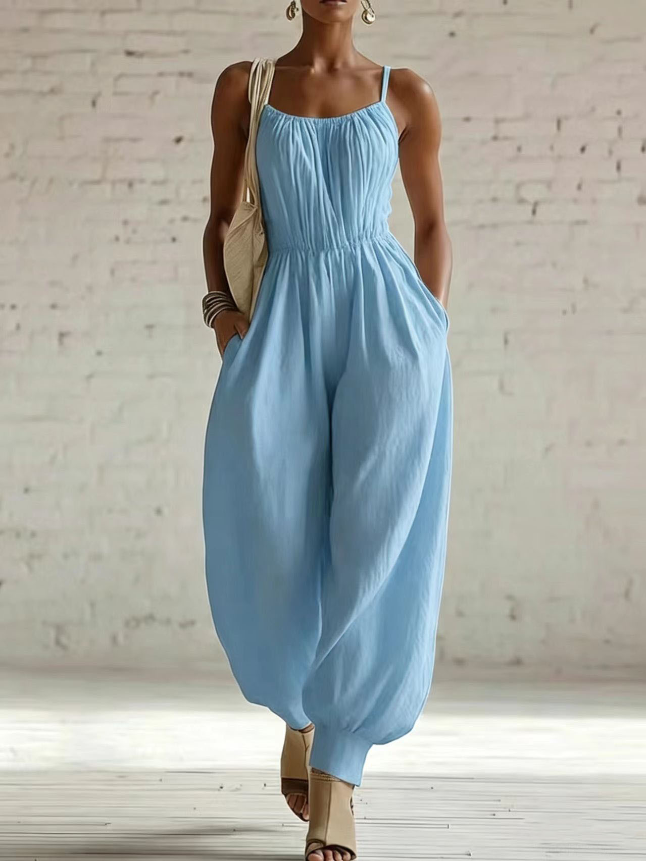 Women's flare-leg jumpsuit in apricot – sleeveless wide-leg knit low waist