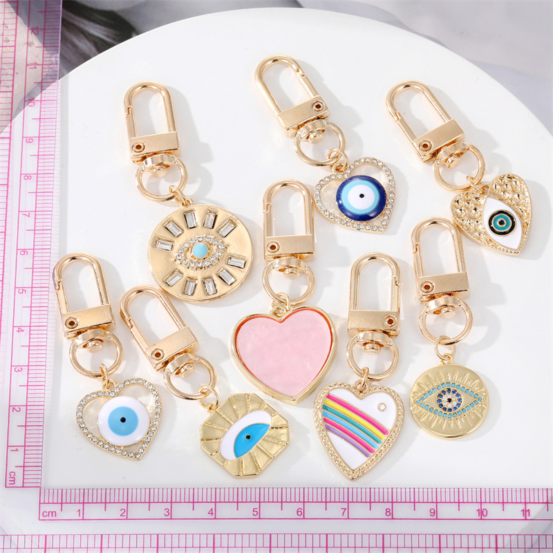 Title 1, Dot Drilling Alloy Love Eye Keychain. A unique ...