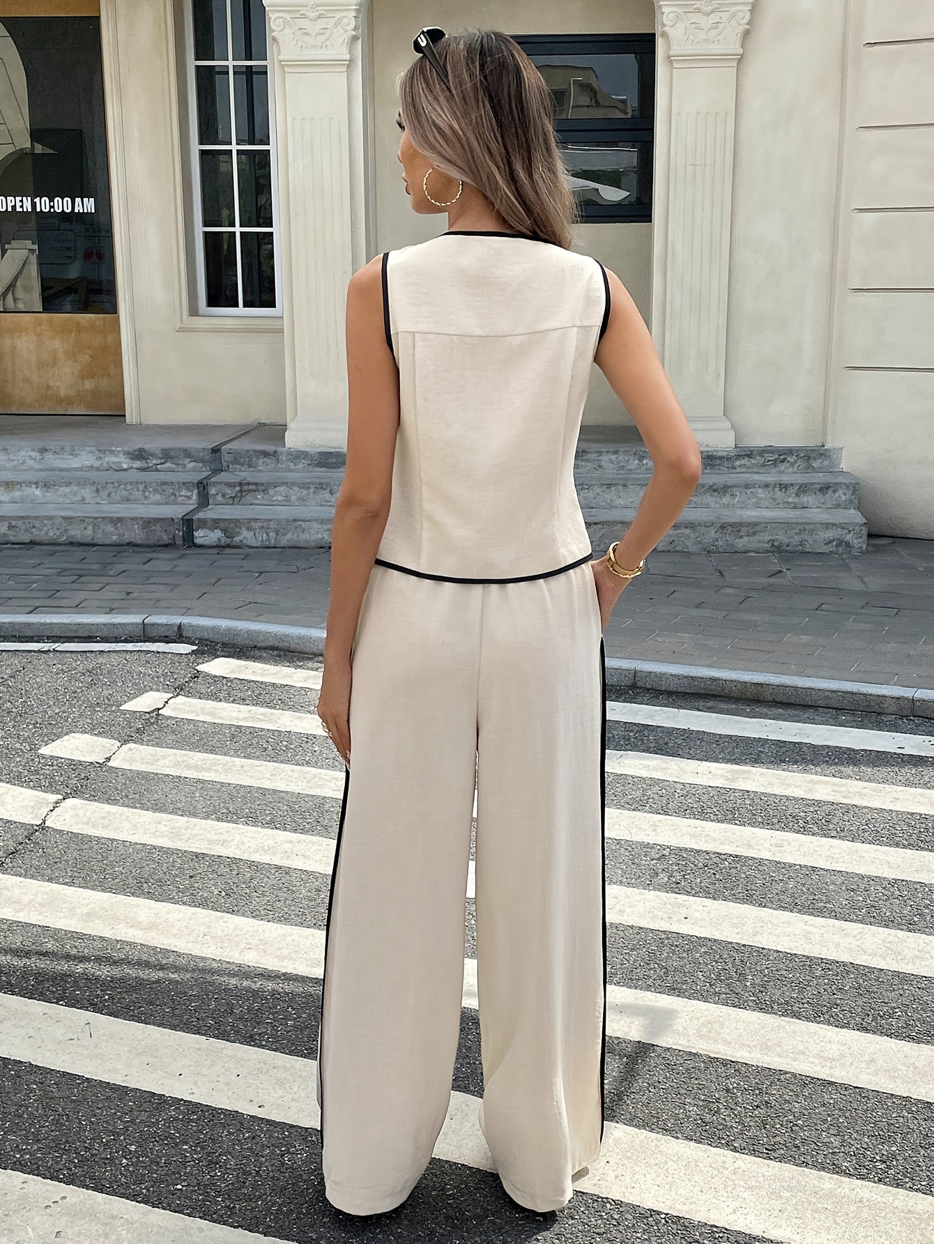 Women's contrast color vest and trousers suit – contrast trim detail close-up