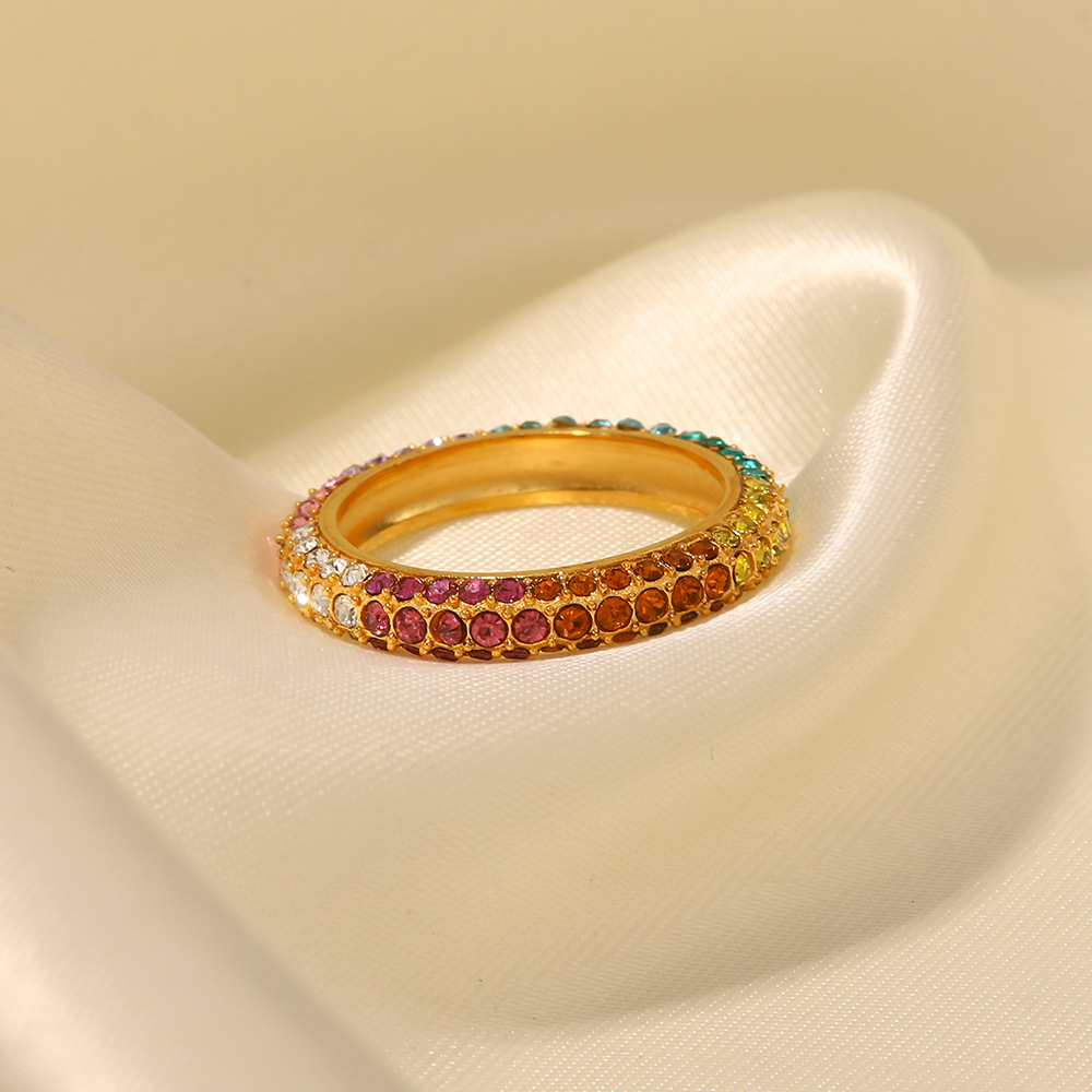 Title 2, Gold-plated stainless steel ring with inlaid co...