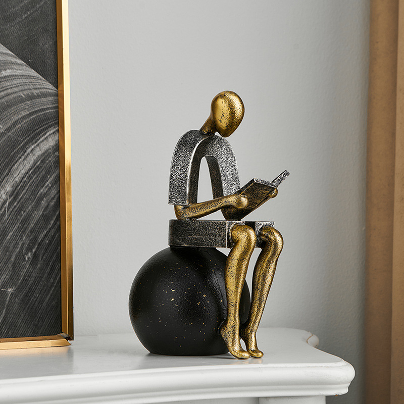 Abstract Resin Desk Ornament Of A Figure Reading And Pondering