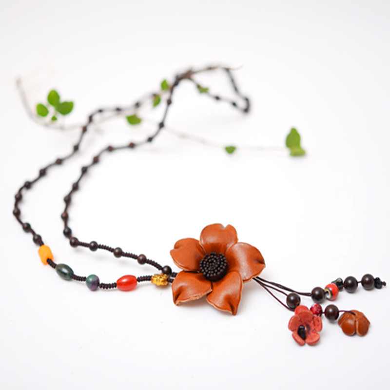 Title 10, Long sweater chain cowhide flower pendant