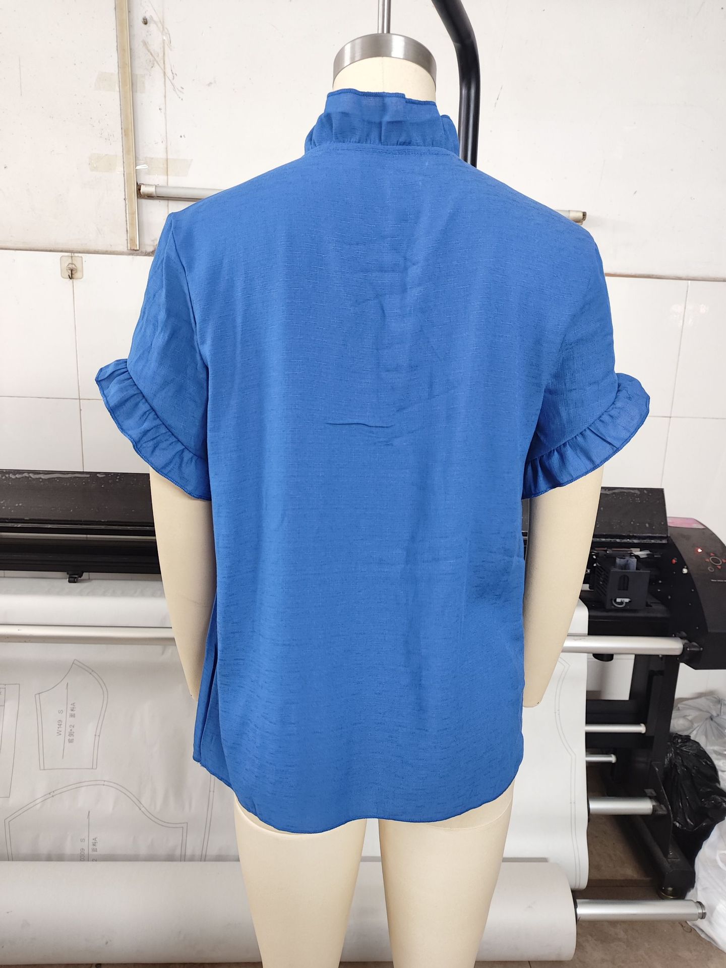 Solid color linen blend top in white, lifestyle photo showing drape and movement